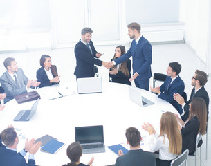 business handshake on corporate meetings in the office, negotiat