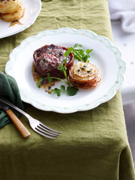 Plate of beef prosciutto steak