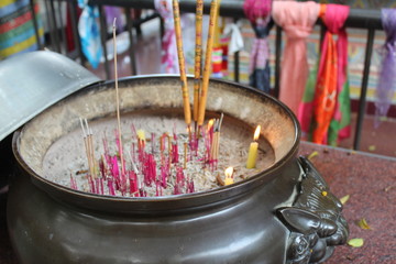 Incense burning in front of a Buddhist Statue in Hong Kong