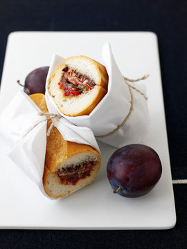 Plate of plums with sandwich