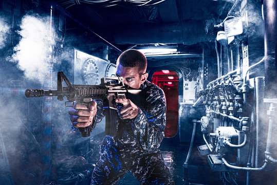 Soldier shooting assault rifle indoors