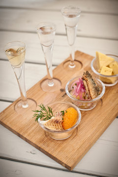 Bowls of food with glasses of wine