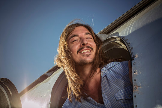 Close-up of a man leaning out of caravan door