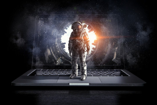 Space explorer and laptop. Mixed media . Mixed media