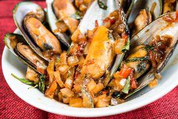 Mussel with white wine sauce on table