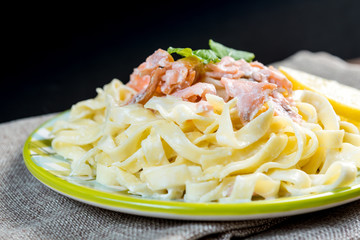 tasty pasta with salmon on a the table