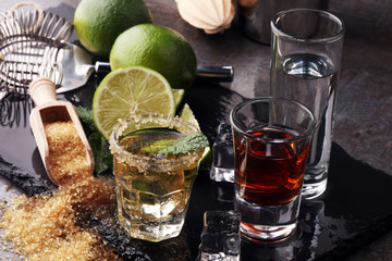 Selection of alcoholic drinks on rustic stone plate