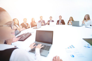 using laptops the Executive assistant shows the participants of 