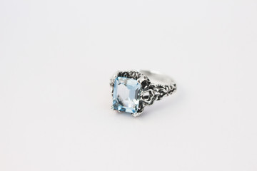 Silver ring with blue topaz