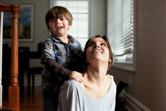 Mother looking up at young son