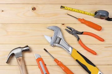 industrial tools on light wooden background with copy space. top view. tools texture. tools background