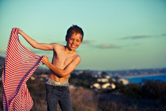 Boy holding striped fabric