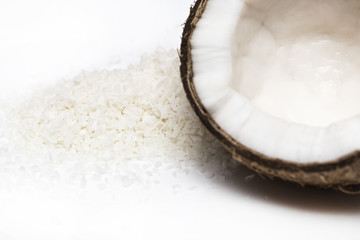 coconuts with coconuts flakes isolated on the white background