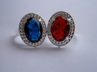 Two stylish rings with red and blue stone