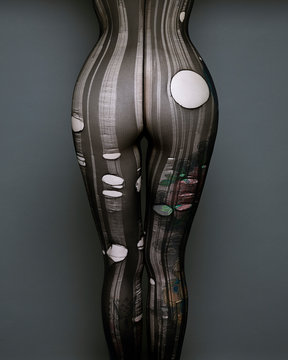 Rear view of woman's buttocks in ripped body stocking