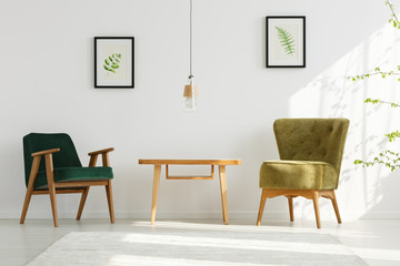 Fototapeta premium White apartment with green armchairs