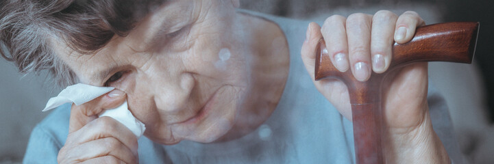 Older woman with dementia crying