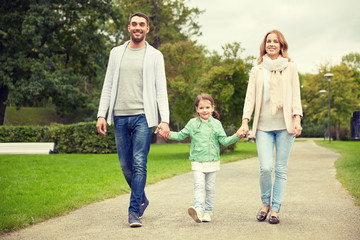 happy family walking in summer park