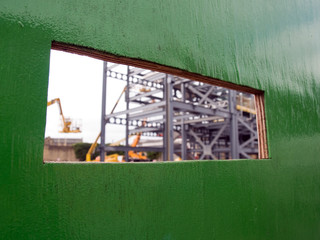 Building site viewing port in surrounding hoardings