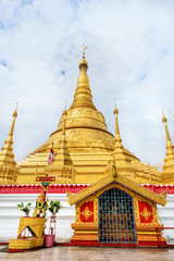 Naklejka premium Tachileik Shwedagon Pagoda is a beautiful golden pagoda that imitates Shwedagon Paya Pagoda, tourist attraction near the Thai border at Tachileik town in Shan State, Myanmar (Burma)