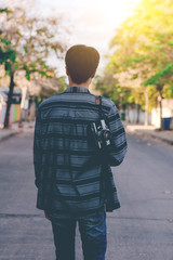 Man with hanging vintage camera.