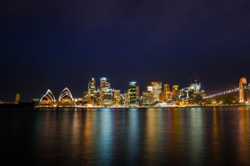 Long exposure night shot of city center of Sydney skyline looking over the harbor