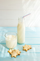Biscuits with milk on wood background in the morning