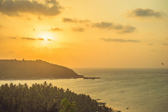 Destroyed fort Chapora on the coast of the Arabian Sea during a cloudy sunset