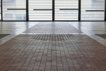 Tiled floor with backlit barred door for concept use