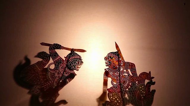 Thai shadow puppet show:Shadow play which is also known as shadow puppetry is an ancient form of storytelling and entertainment which uses flat articulated figures (shadow puppets)