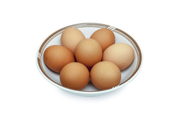 Eggs in a cup on a white background.