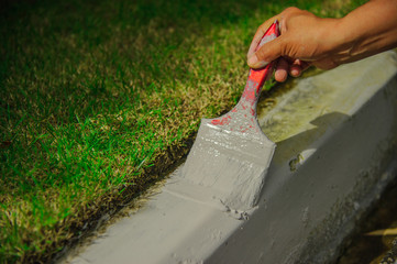 Naklejka premium construction worker painting curb