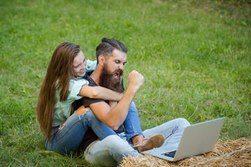 couple of student and girl study on laptop on grass