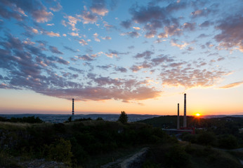 Sunset above the chimney, chemical industry