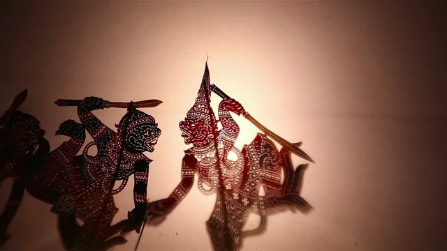 Thai shadow puppet show:Shadow play which is also known as shadow puppetry is an ancient form of storytelling and entertainment which uses flat articulated figures (shadow puppets)