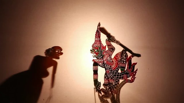 Thai shadow puppet show:Shadow play which is also known as shadow puppetry is an ancient form of storytelling and entertainment which uses flat articulated figures (shadow puppets)