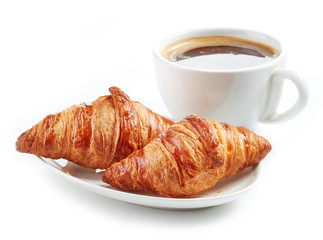 fresh croissants and coffee cup