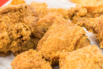Fried chicken wings on wooden table. Breaded Crispy fried kentucky chicken tasty dinner.