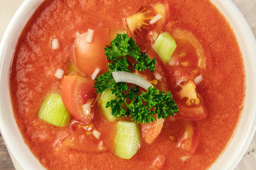 A closeup of a bowl of gazpacho soup
