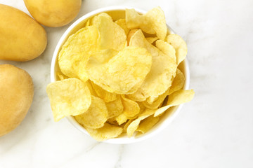 Chips with potatoes, shot from above with copyspace