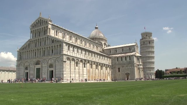 People walking around the Tower and Cathedral of Pisa