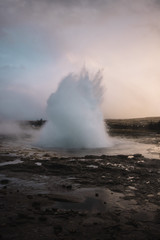 Beautiful geyser valley in Iceland.Erupting geyser