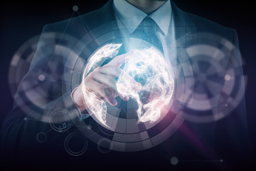 Businessman pointing at globe