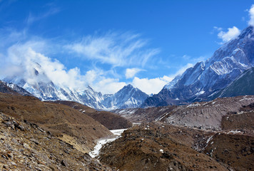 Beautiful Himalayan Mountains covered with clouds on the way to Everest basecamp, Nepal.