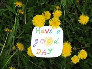 Naklejka premium Paper note with phrase: Have a good day. Positive attitude concept