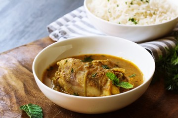 Chicken Curry served with Cooked Basmati rice,selective focus