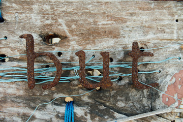 Old iron letters. Vintage signboard with text from iron corrosion letters signs