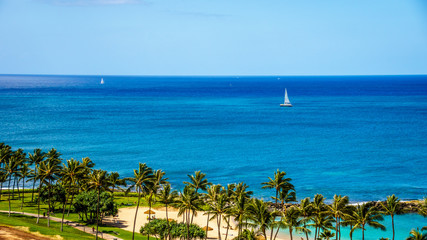 Sail Boat in the Pacific Ocean just off the coast at the resort community of Ko Olina on the West Coast of the Hawaiian island of Oahu