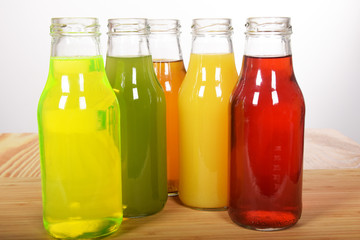 Colorful fruit juices in glass bottles for a healthy breakfast