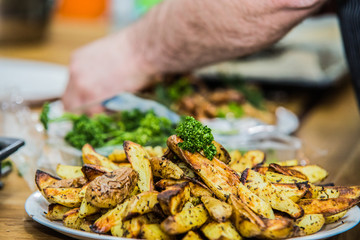 The chef in the kitchen prepares  food with.